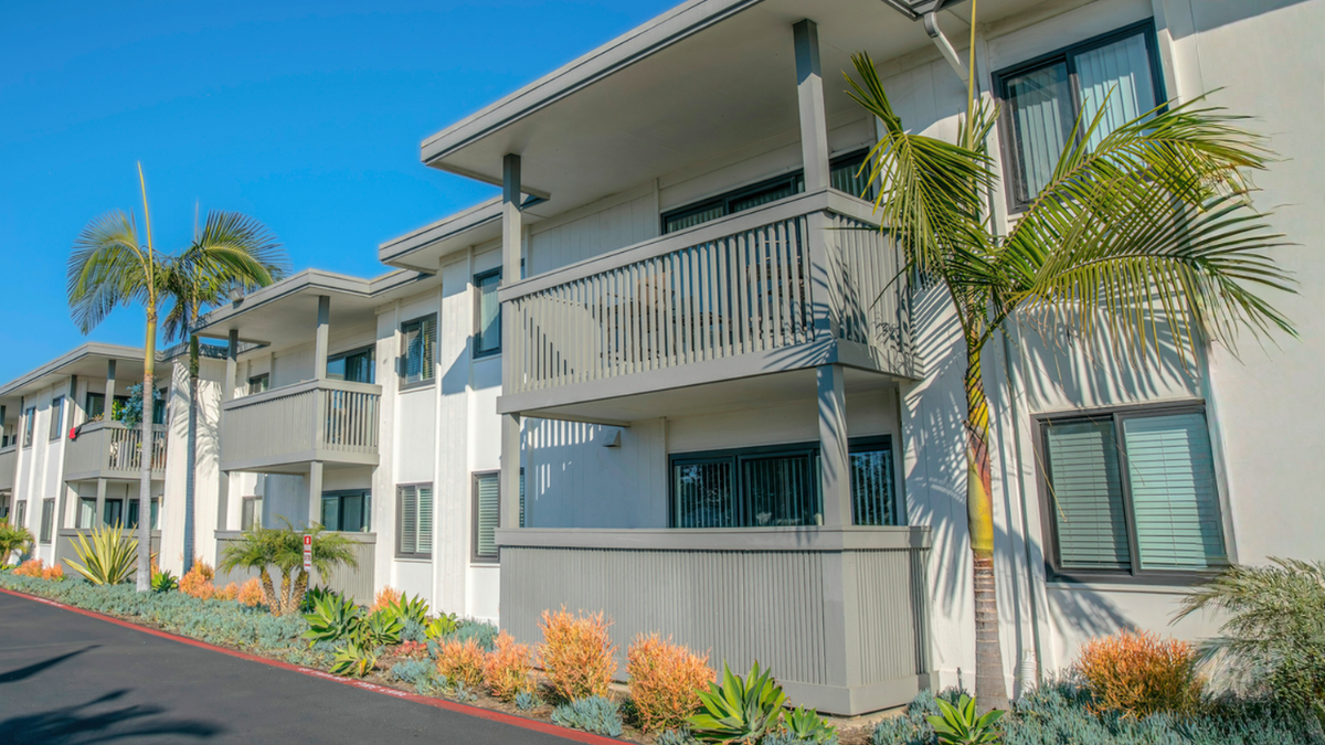 Apartment rental property exterior shows hidden costs landlords face when self-managing maintenance, vacancies, and tenants.