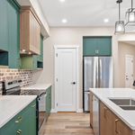 Renovated Toronto kitchen showcases modern cabinets, island, lighting, and contractor quality for 2026 upgrades.