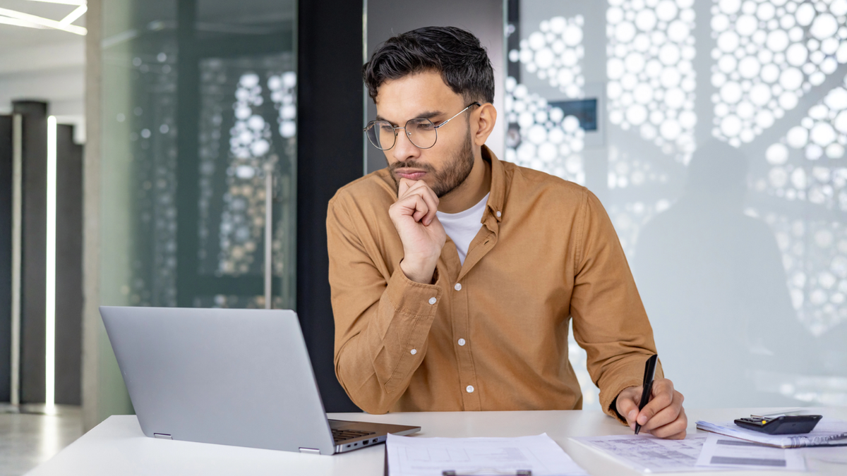 Property market investor reviews plans online to set practical real estate goals and growth strategy.
