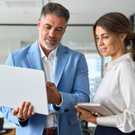 Investors reviewing data online to find off-market real estate deals through proven sourcing strategies faster.