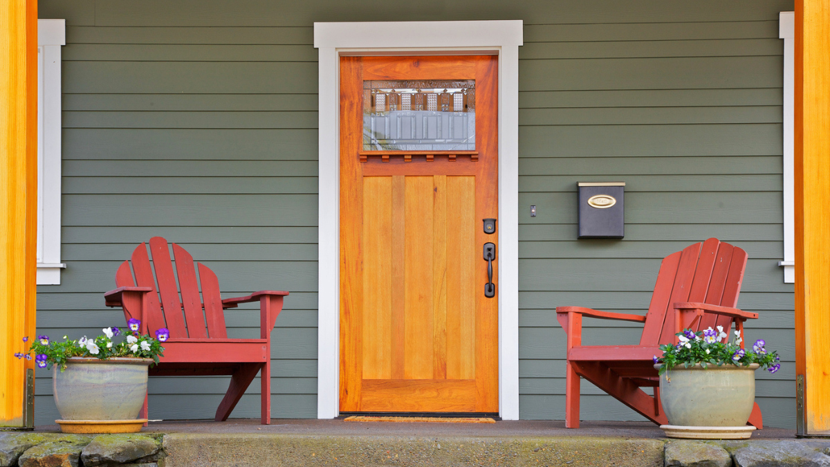 Secure rental entry with strong door, visible lighting, and porch details that deter unwanted access.