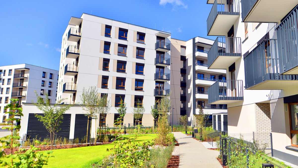 Multi-unit rental apartment community with landscaped grounds supports preventative maintenance scheduling for long-term property care.