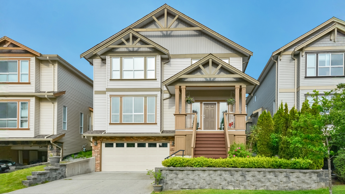 Street view of a North American house that can used to live in and also generate rental income.