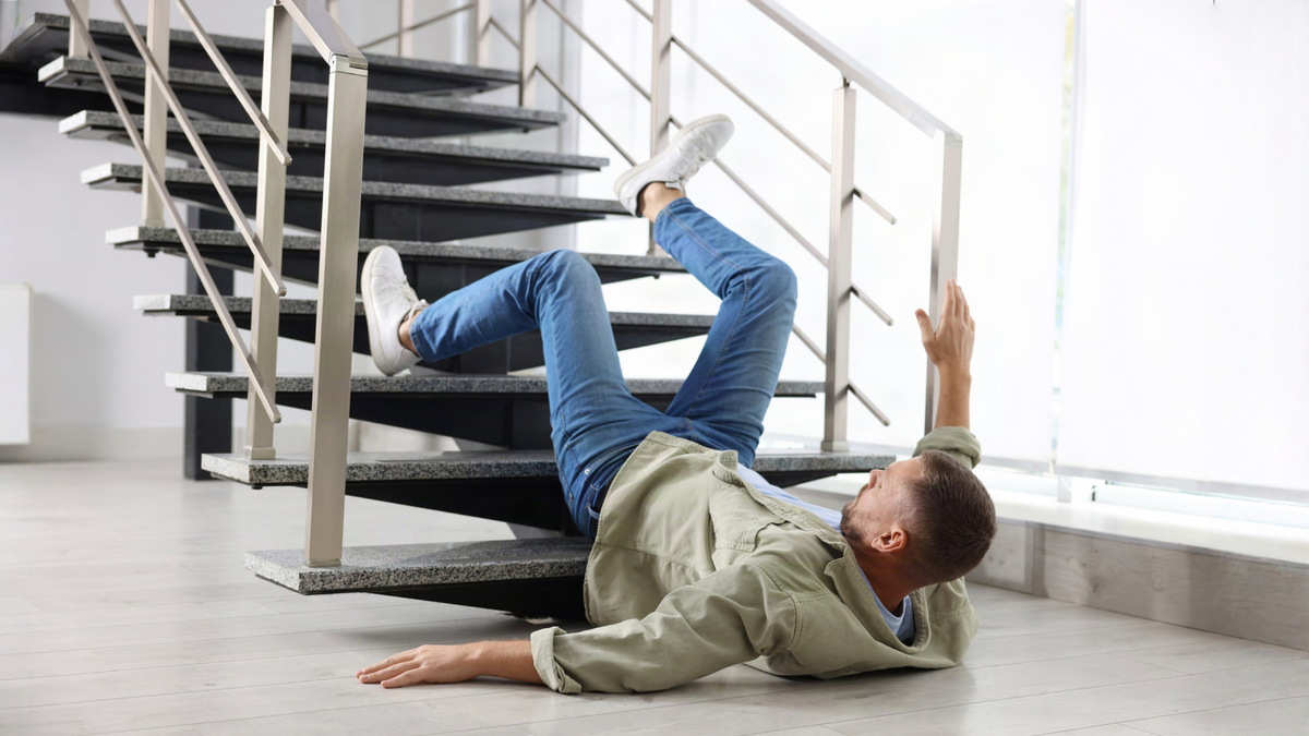 Tenant slipping on rental property stairs illustrates catastrophic injury risks from unsafe conditions and liability.