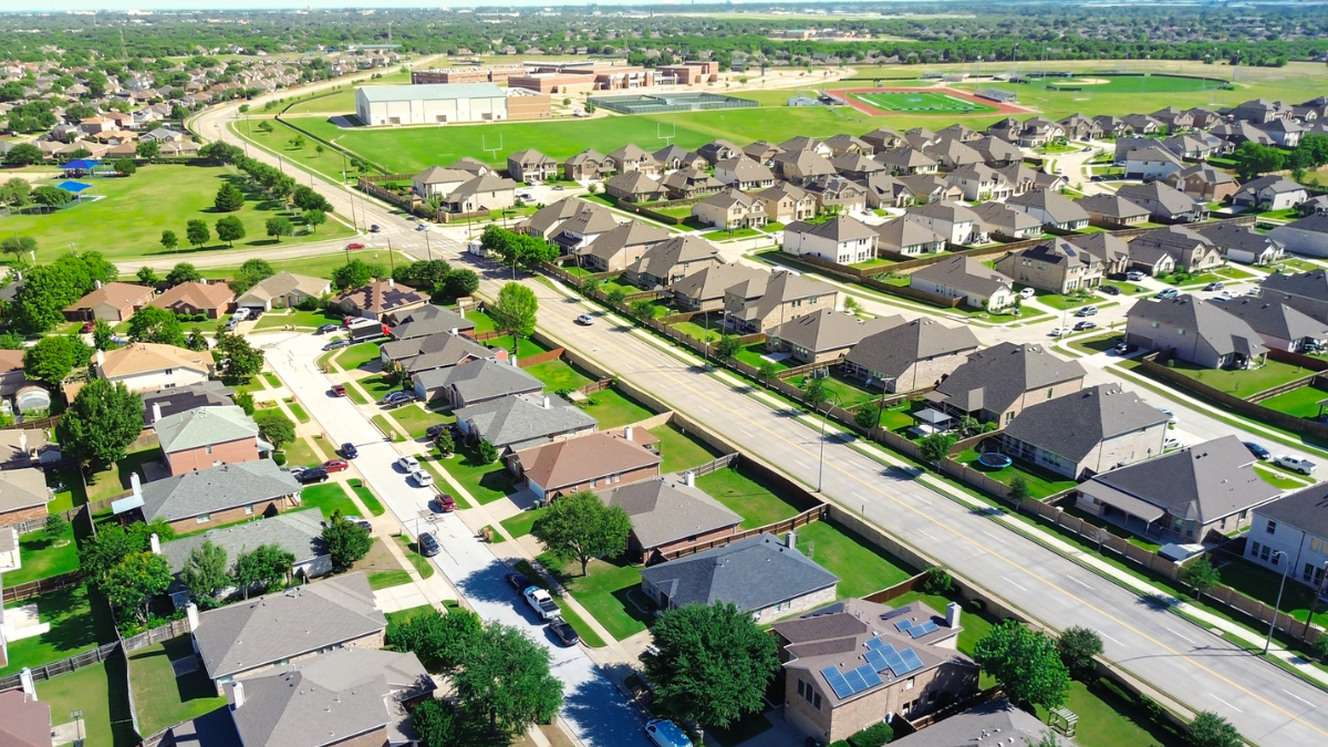 Aerial neighborhood view helps landlords use unified listing data to identify real estate trends faster.
