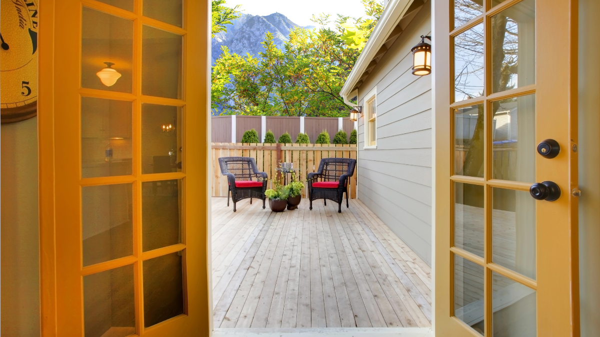 View through french doors to outside living space