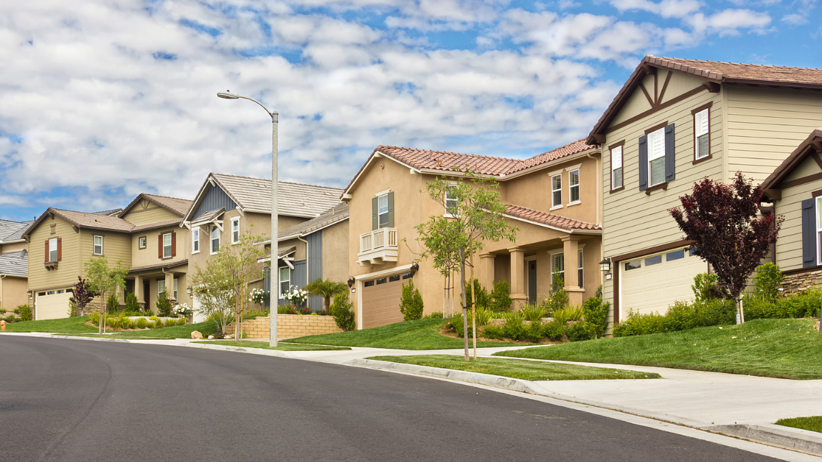 Suburban residential neighborhood with sloping street.