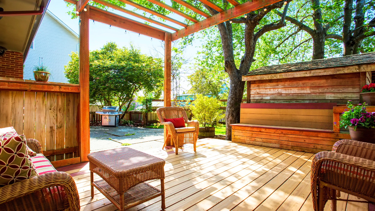 Backyard deck with furniture and pergola