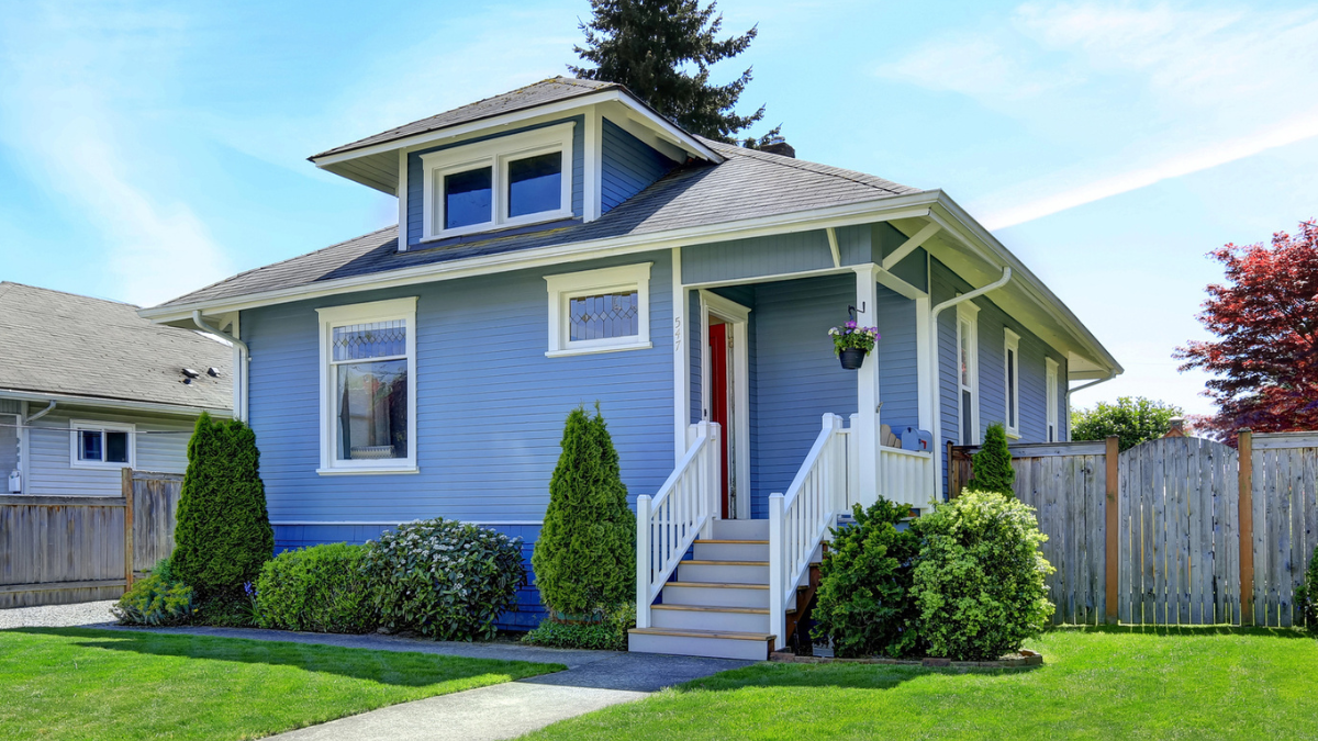 Blue bungalow home exterior showing property sellers how cash home buyers evaluate houses quickly for offers.
