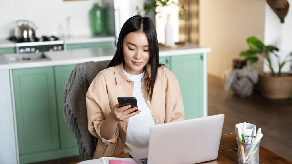Airbnb host checking guest reviews online after cleaning rental property to improve ratings and satisfaction.