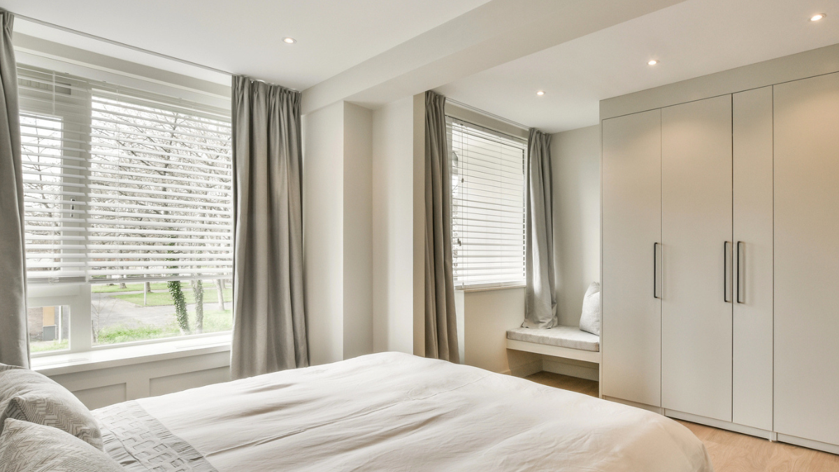 Curtains and blinds brighten rental bedroom, boosting privacy, comfort, and tenant appeal for landlords today.