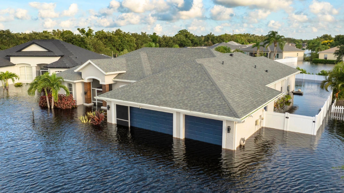 Flooded rental property shows water damage reducing home value, rental income, and investor returns significantly.