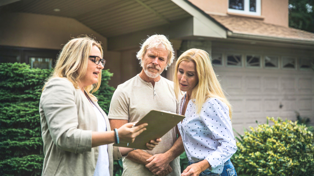 Real estate agent helps buyers compare home value factors beyond listing price before making offers.