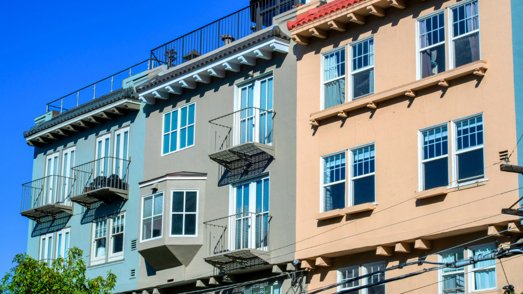 Upgraded windows on multifamily rental property exterior improve tenant retention, curb appeal, and property value.