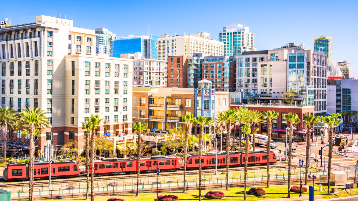 San Diego skyline with transit highlights cost of living comparison versus Dallas for relocating renters.