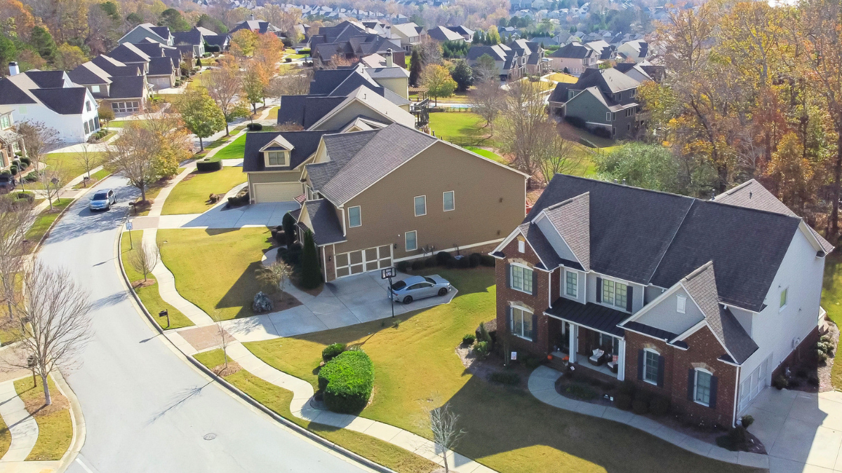 Aerial view of HOA community highlights real estate dispute resolution and legal solutions for homeowners.