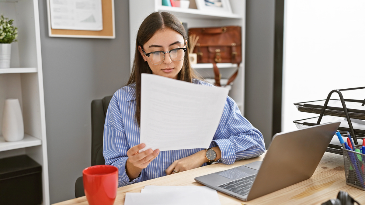 Landlord reviewing cross-border lease agreement for international tenants to ensure compliant rental documentation and terms.