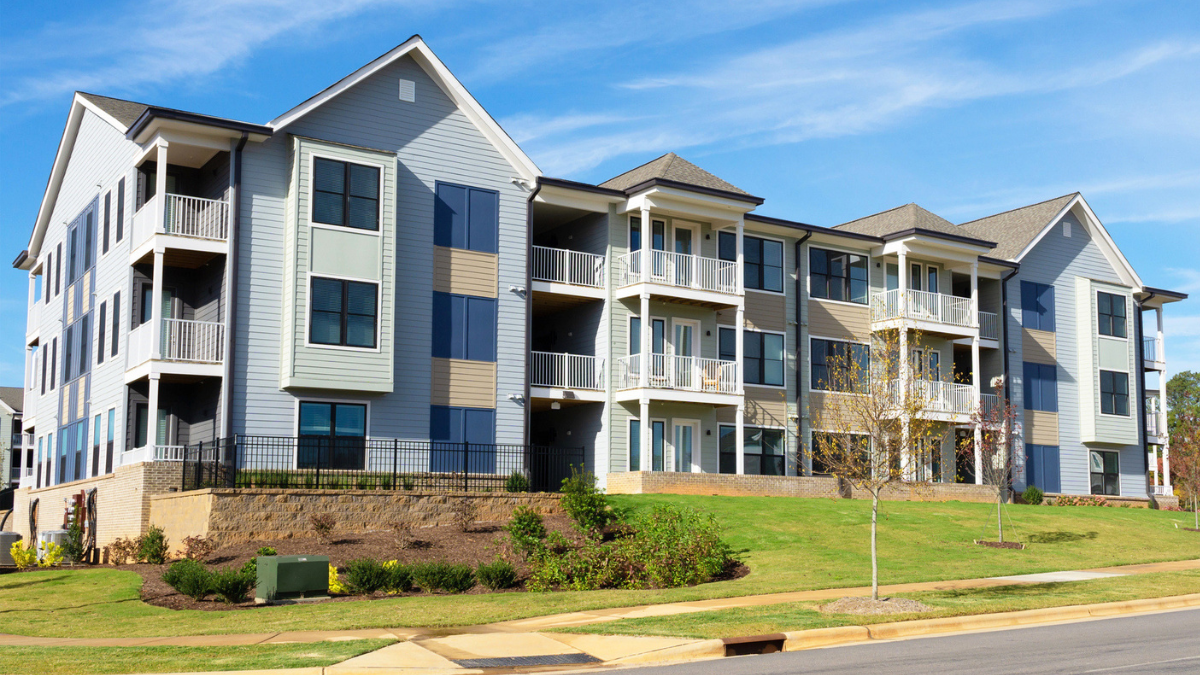 Apartment building illustrates renting versus buying decisions for North American financial planning and housing choices.