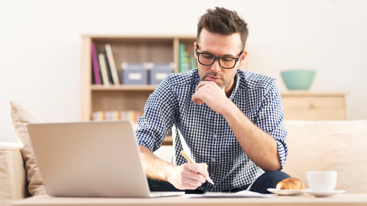Savy real estate investor reviewing property insurance and home warranty plans.