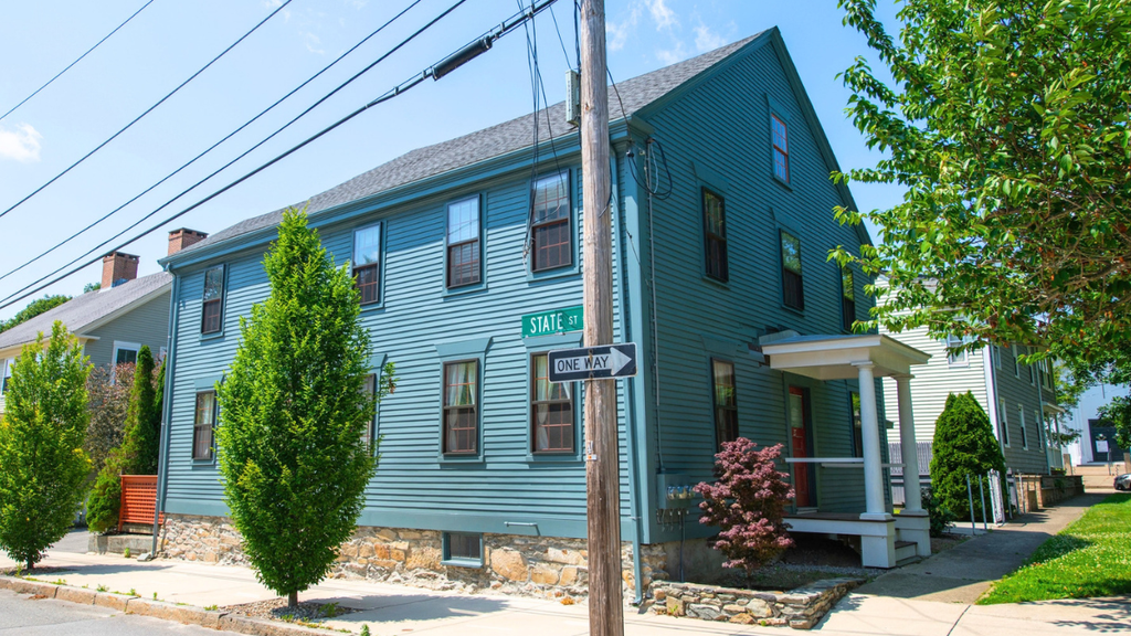 Older rental property exterior highlights recurring repair problems landlords often face with aging homes and systems.