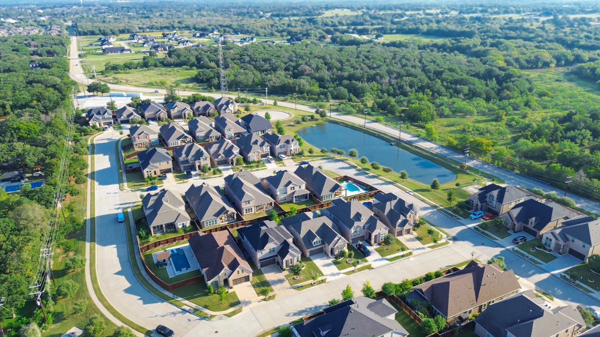 Aerial view of master-planned community with homes and streets.