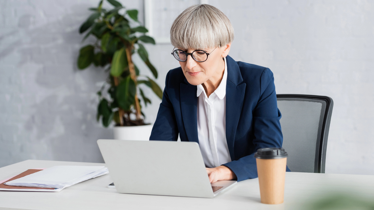 Landlord reviewing tenant background check report online to understand screening details before rental approval decisions.