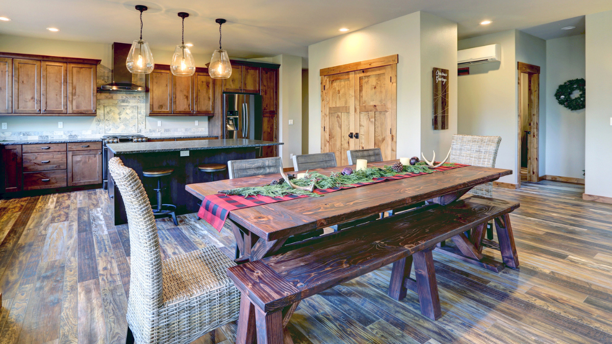 Reclaimed wood flooring in rental property dining area showcases durable species for long-term landlord value.