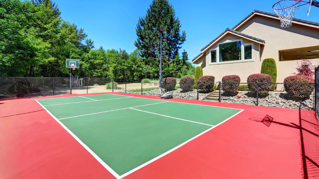 Residential basketball court adds rental property value and recreation appeal for real estate investors and families.